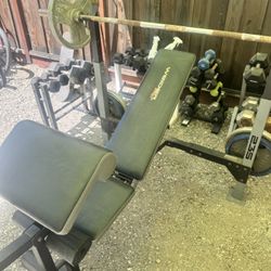 Bench and leg extension set with a barbell 150 bucks