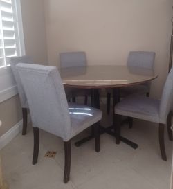 54 inches round dining table set with 5 chairs