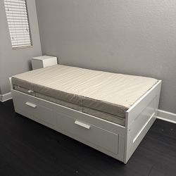 BRIMNES bed and 2 mattresses
