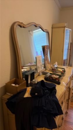 The whole bedroom sets going for $260. That's the mirror of the bed the mattress, the China cabinet and the desk and the dresser.