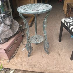 old cast iron plant stand its 28 inches tall and 15 inches across the top