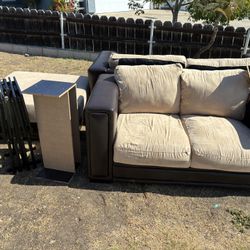 Couches, ottoman, shoe rack, and foldable tables 