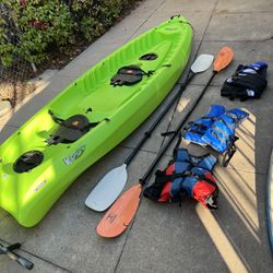Kayak w/ Paddles and Life Jackets