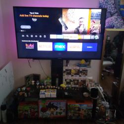 50 Inch Tv With Free Fire stick and Three In One Mounted Xavier Brand Entertainment System. 