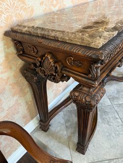 Ornate carved sofa table