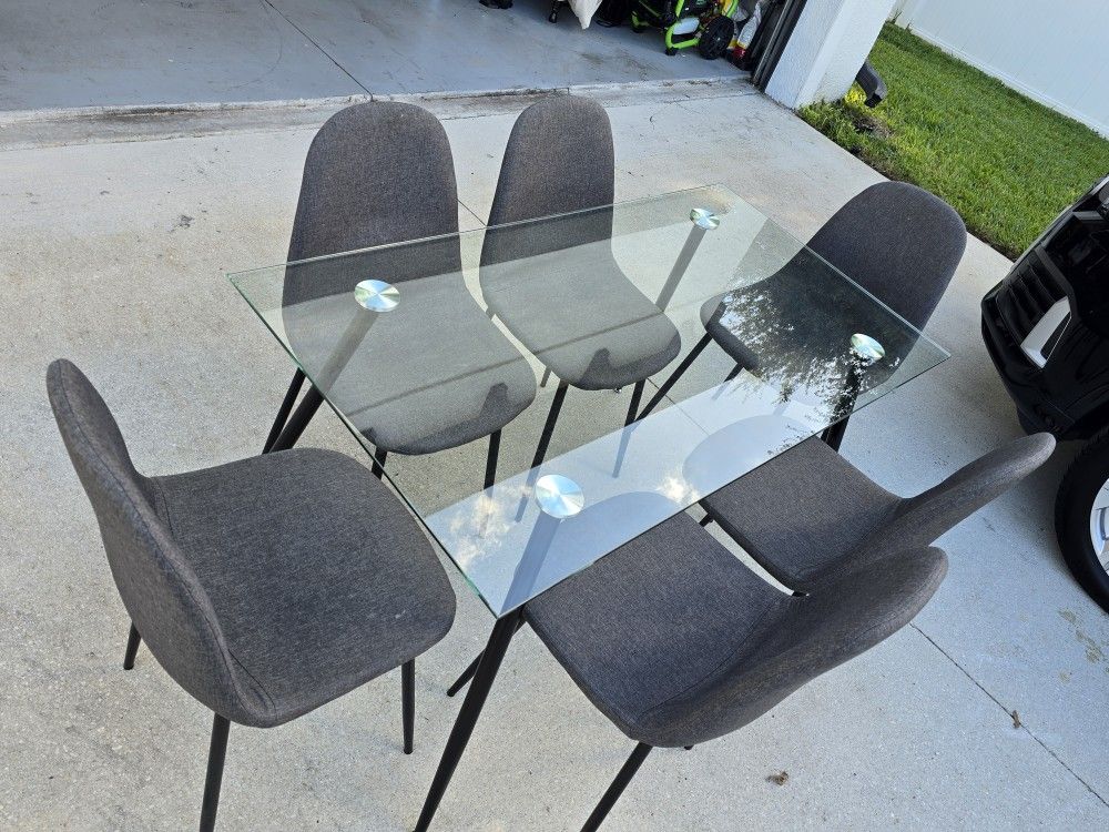 Glass Dining Table And 6 Gray Chairs