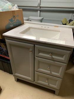 Counter top sink faucet with cabinet