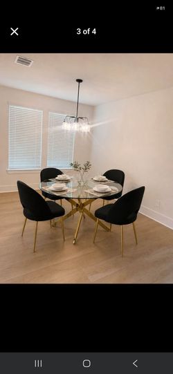 Round Glass Dining Table with 4 Black Chairs