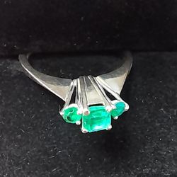 Beautiful ring of genuine emeralds on white gold