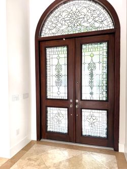 Custom Double Entry Door with Decorative Glass & Arched Transom