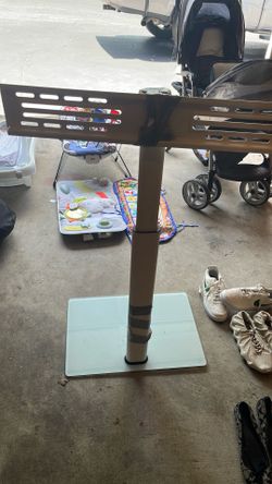 White adjustable TV stand glass bottom use a few time in good condition