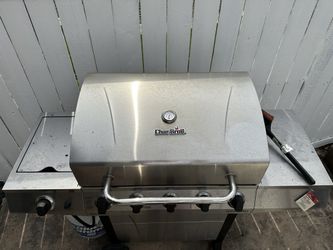 Char Broil Stainless Steel Gas Grill with Cart Wheels and with Side Burner.
