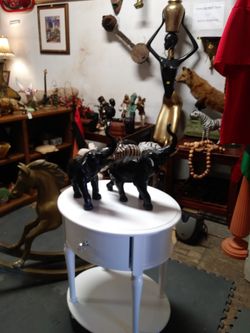 Pair of large cast metal elephants with trunks up for sale