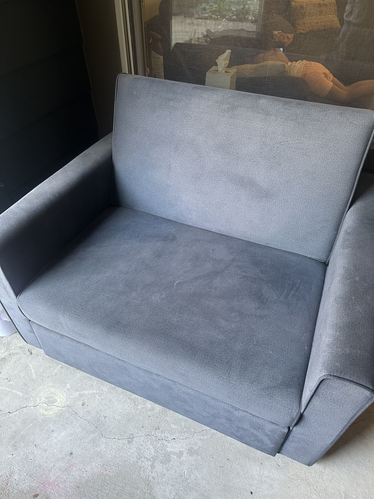 Love seat that folds out to a twin bed