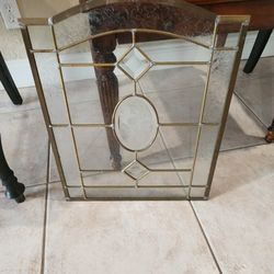 Antique etched glass and brass window.