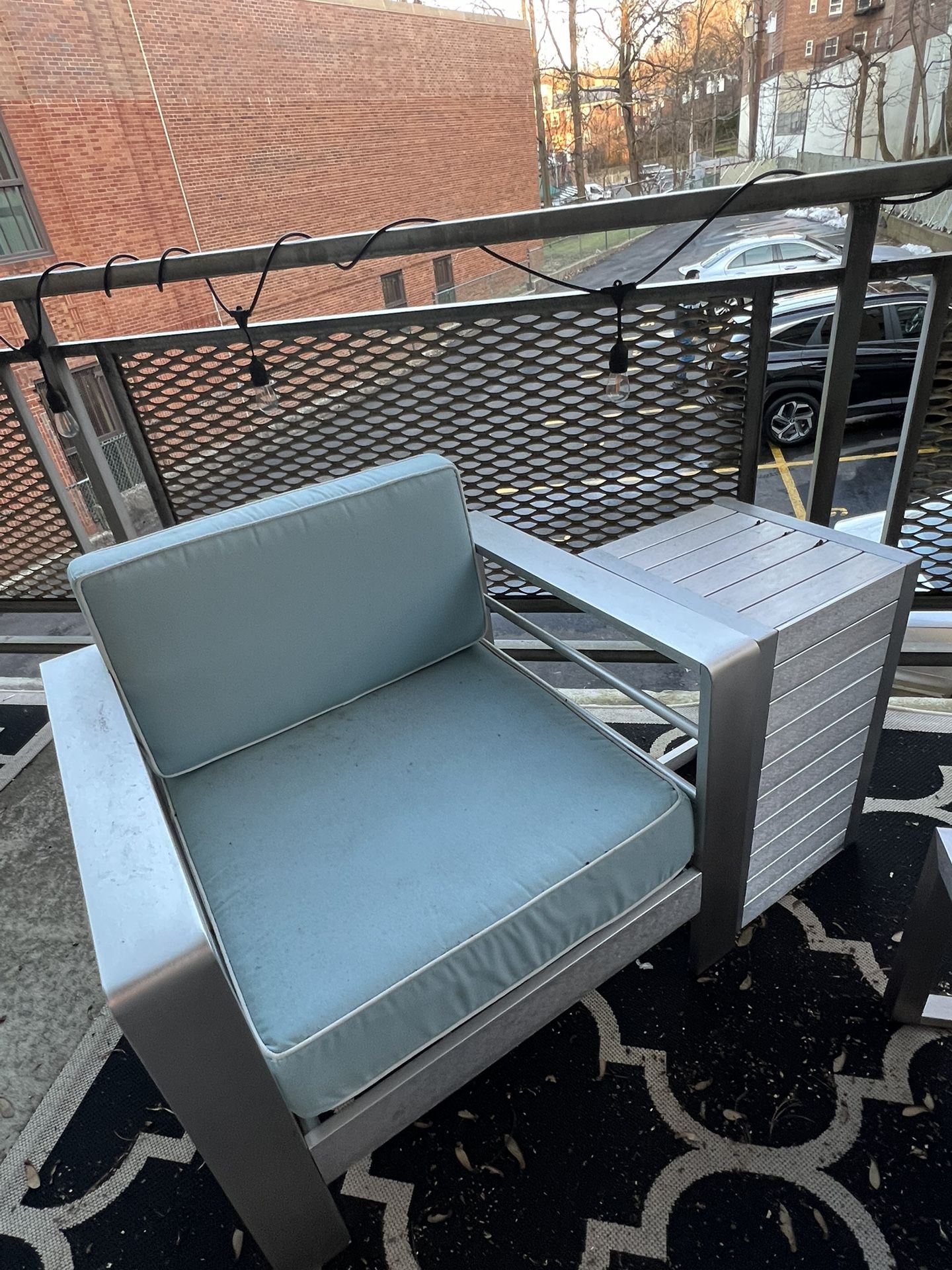 2 Aluminum Outdoor Chairs With Light Blue Cushions with side table
