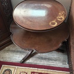 Two tier mahogany brass feet pedestal coffee table