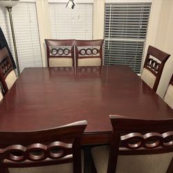 Dining Table 8 Cushy Chairs.