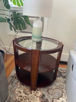 Oval end table with glass insert.