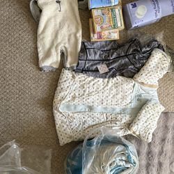5 boxes of baby rice cereal, clothes for babies over 12 months old, bed rail total $5