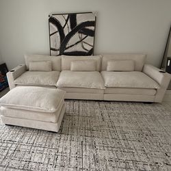 Off white couch, rug, and frame