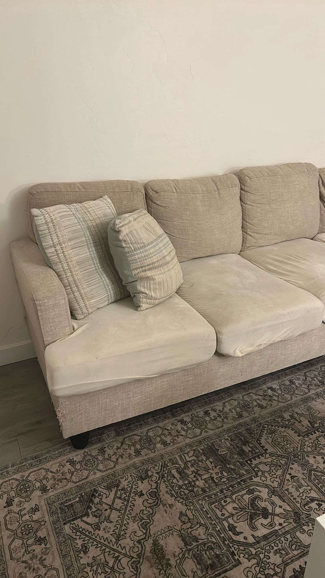 beige L shaped sofa