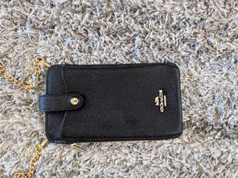 COACH North/South Phone Crossbody bag in black cross grain leather.