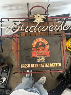 Neon lights, Budweiser and Miller
