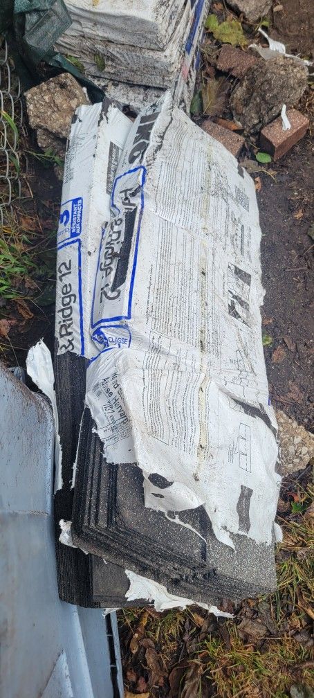 roofing shingles n center caps ... 6 bundles of grey shingles n 2 bundles of center caps