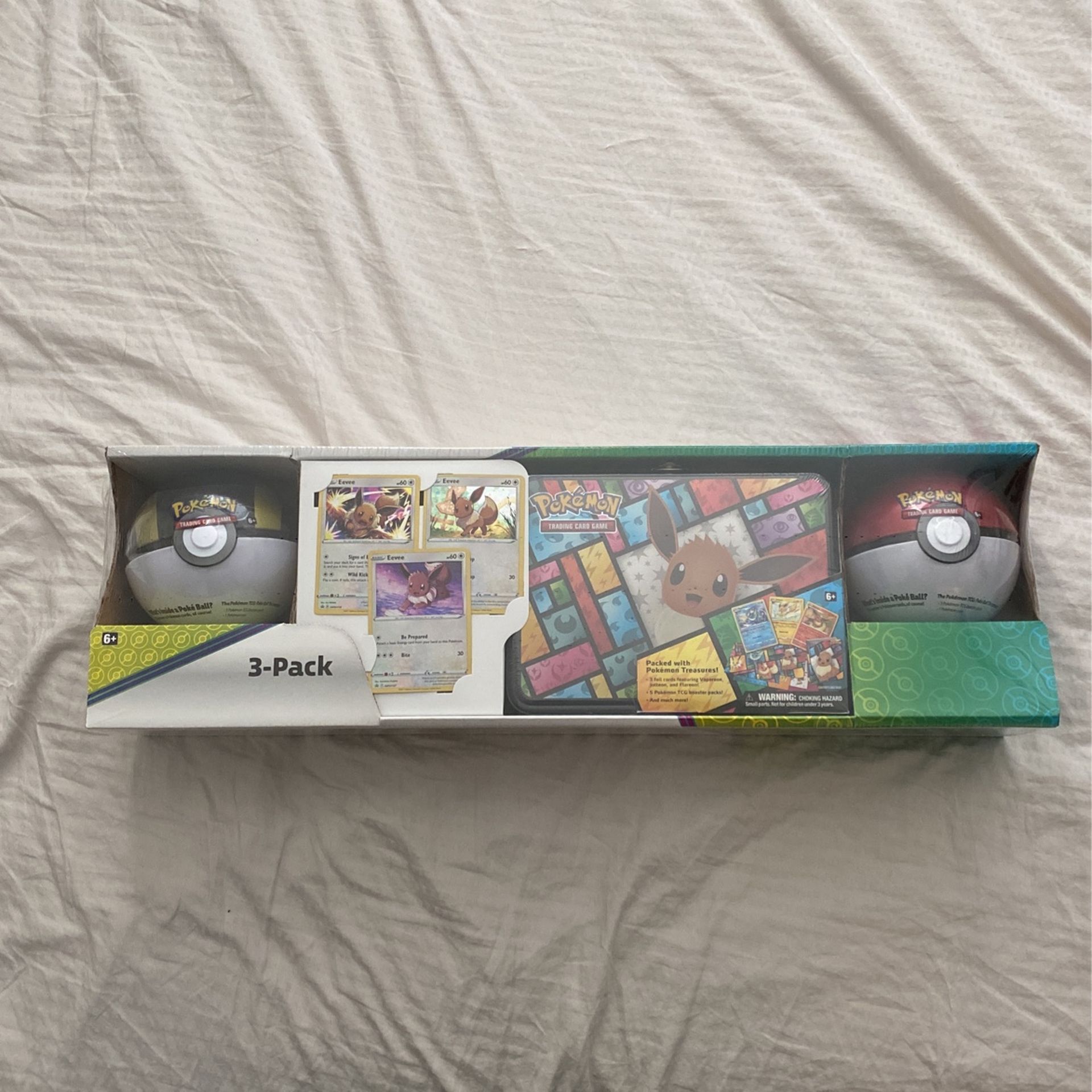 Pokemon  Cards 3-Pack Treasure Chest and 2 Poke Ball Tins From Costco