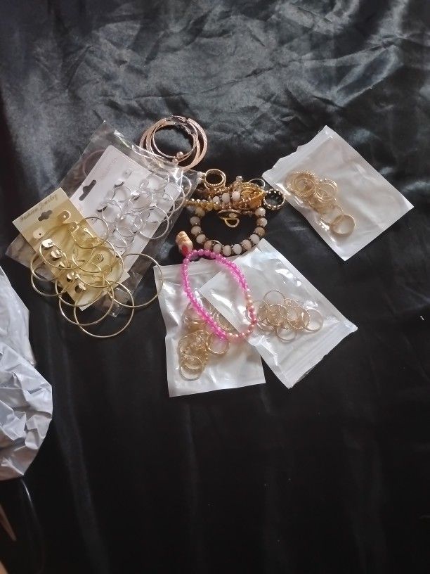 Three Packs Of Pretty Golden Rings Three Bracelets Two Packs Of Silver And Gold Earring