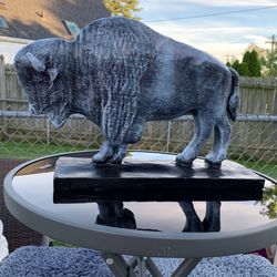 The old gray buffalo statue