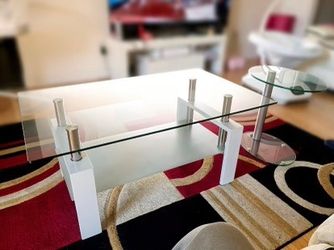 Modern glass coffee table and side table set with white wood and chrome accents.