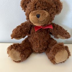 Small dark brown red bow bear