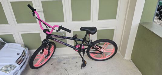 20-inch Mongoose Craze Freestyle BMX bike for girls.