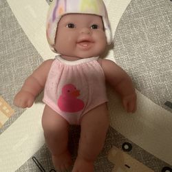 Cranial band/helmet support doll