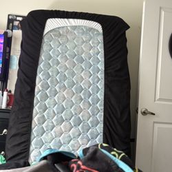 2 Twin Mattresses And A Black Twin Bunk Bed 