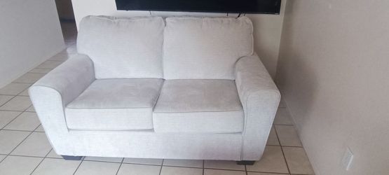 Beige loveseat 62"W x 36"H x 37D