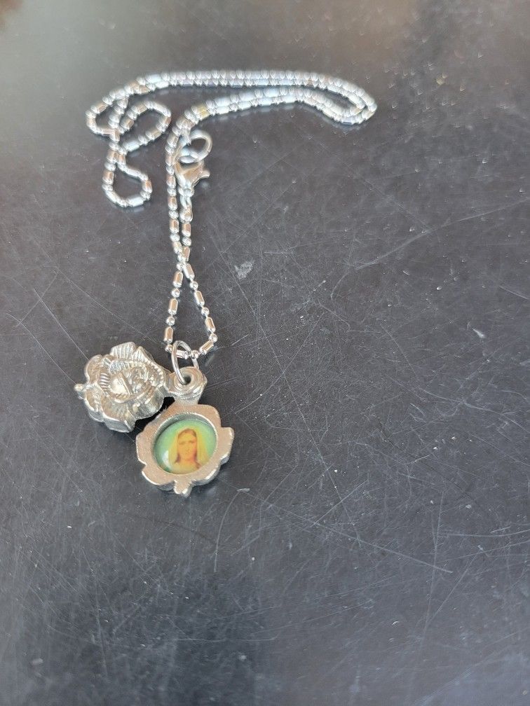 tiny religious locket