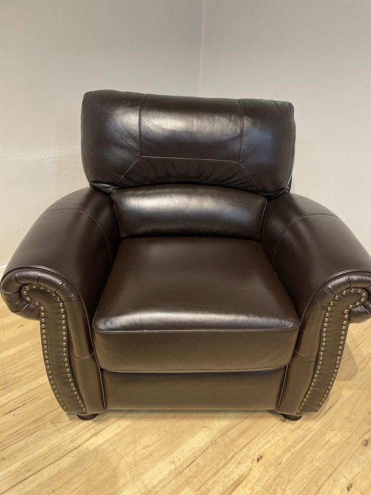 Dark brown leather arm chair