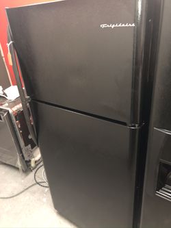 Used Frigidaire 18 cu ft top and bottom fridge. 1 year warranty