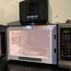 Microwave and toaster basically like new! Stainless steel/black