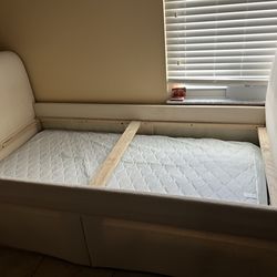 Day bed includes extra  roll out bed frame.
