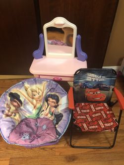 small circular chair a dressing table and a chair of the carts.