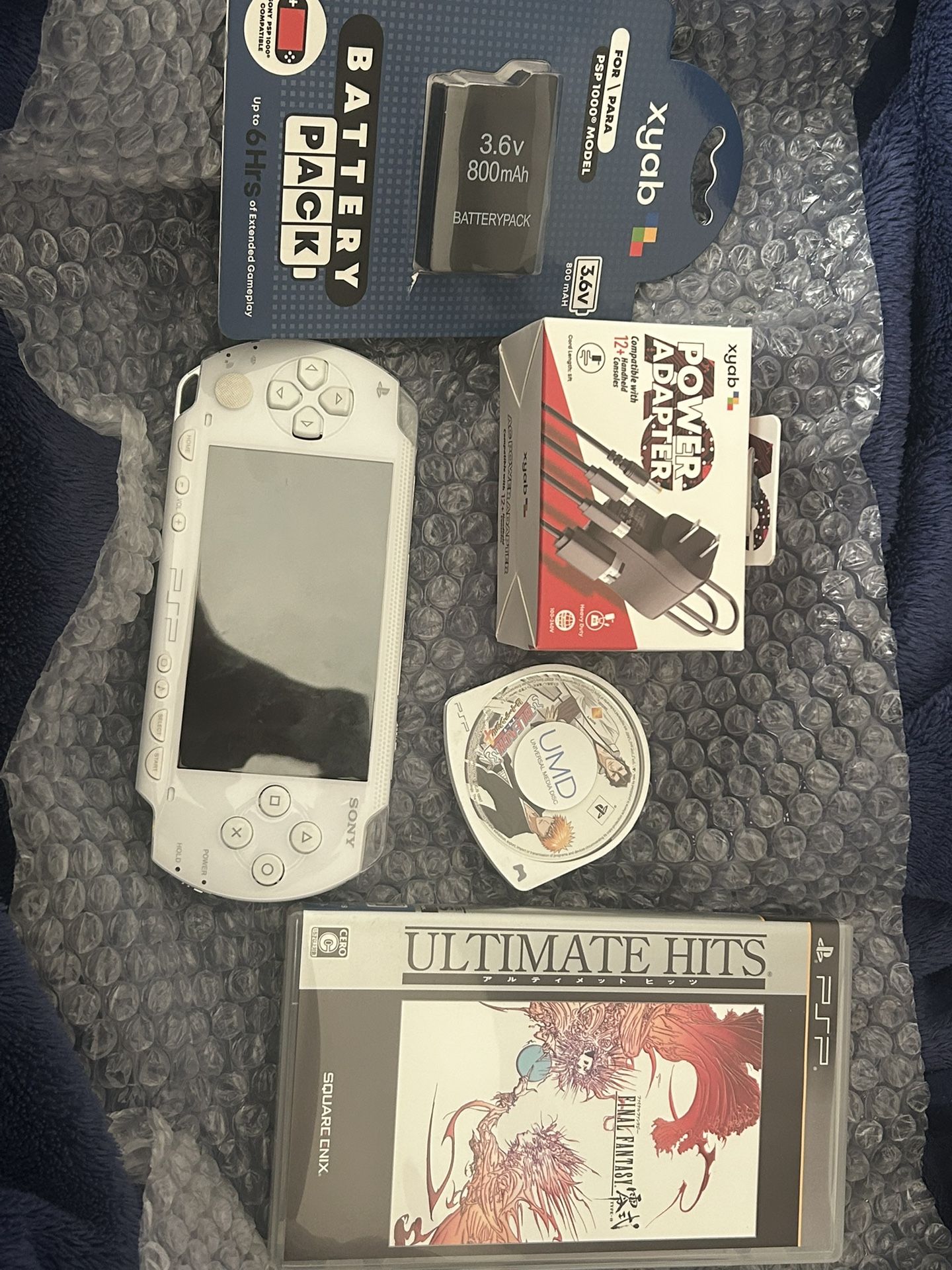 PSP 1000 Japanese version with new battery and charger and 2 games.