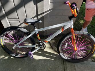 Se Bike So Cal 24 In With Maxis And Purple Spokes With Purple Pedals