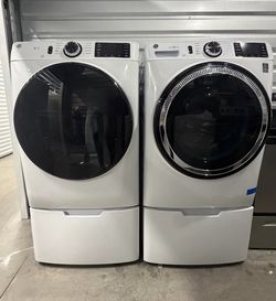 GE Front Load Washer and Dryer Set with Pedestals