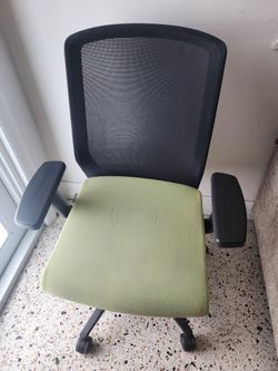 Ergonomic mesh office chair green cushion.