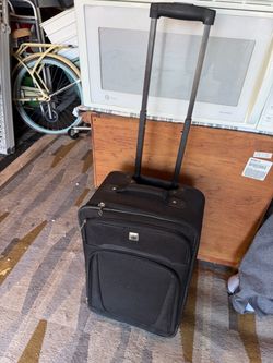 Rolling luggage - 23”L X 14”W X 8”D