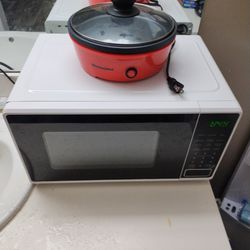 White And Black Microvave And Red 2 Person Griddle Both Are In Very Good Condition Griddle Is Only 3 Days Old Only Been Used Once Selling Both Applian